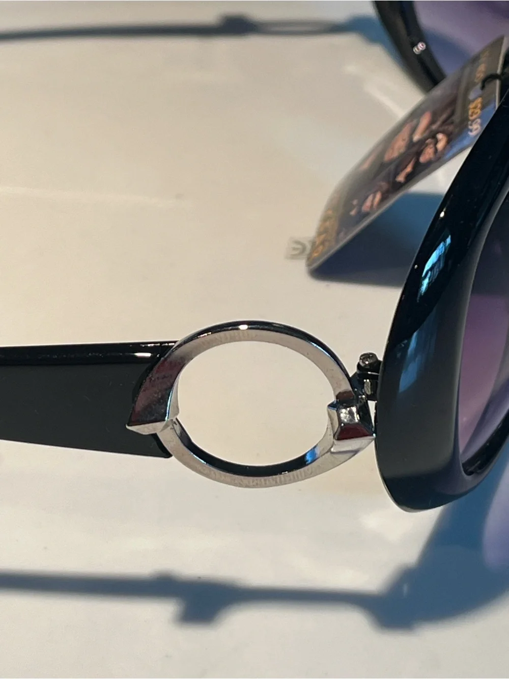 NWT fabulous oversized black sunglasses with violet lenses.